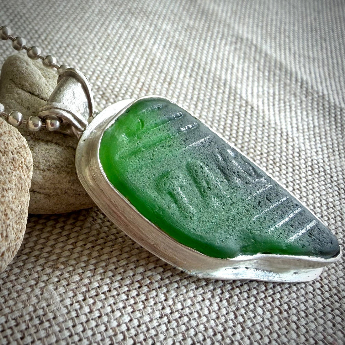 Reading the Waves: The Stories Hidden in Embossed Sea Glass